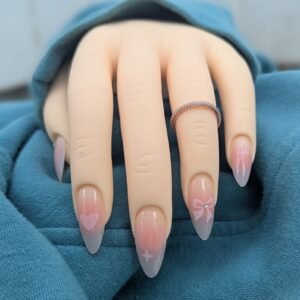 soft pink ombre press on nails displayed on mannequin hand