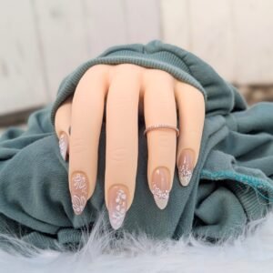 neutral almond press on nails with white floral designs and soft French tips