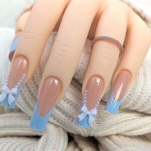 long square blue French tip press on nails with nude base, pearls, and 3D white bows